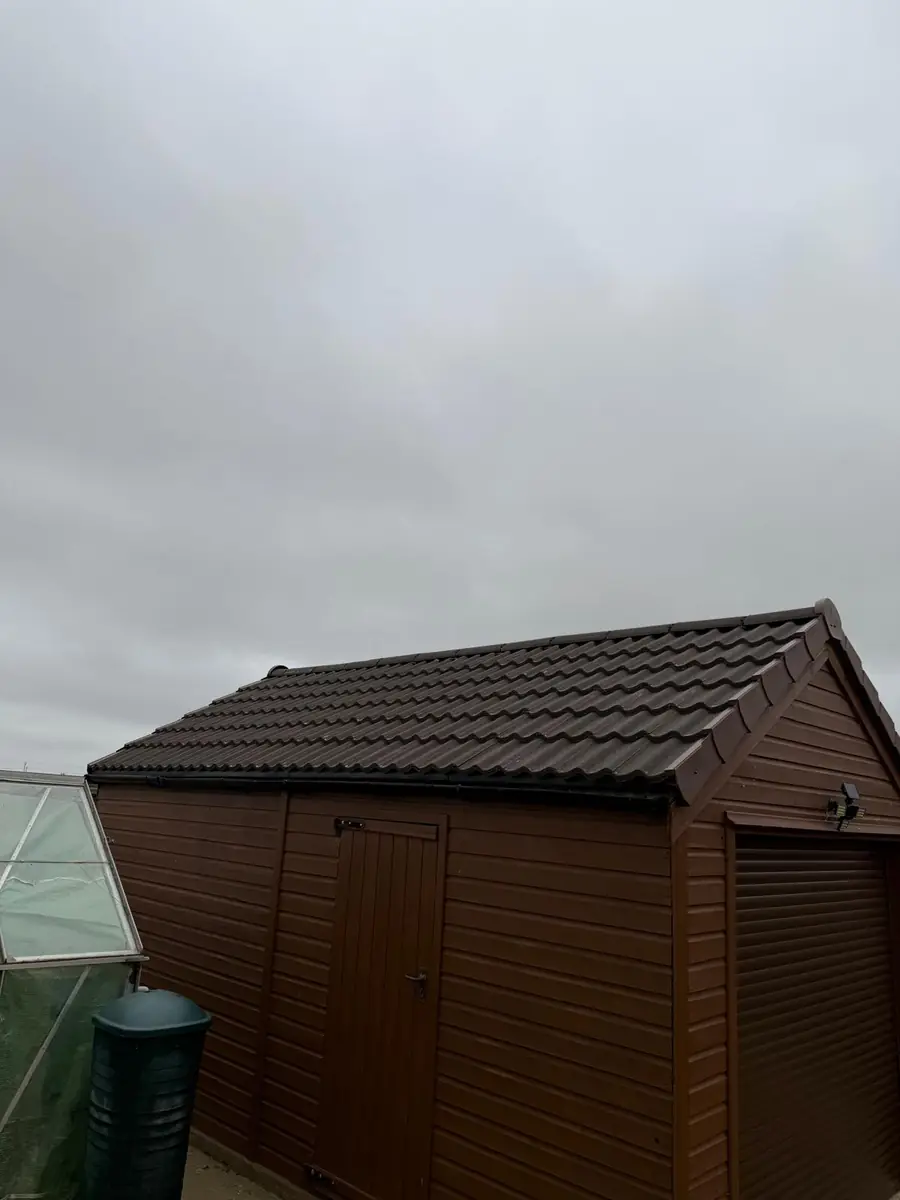 Garage roof in Redland 49 tile and a torch-on felt summer house roof, image 2