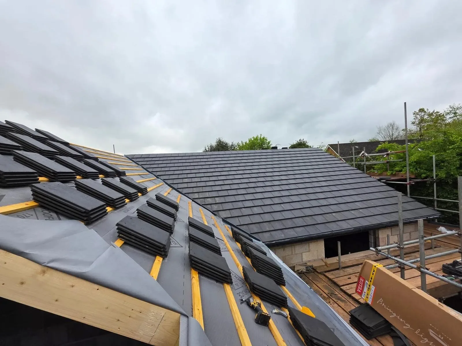 A new build roofed in dark concrete tile, with rooflights, image 15