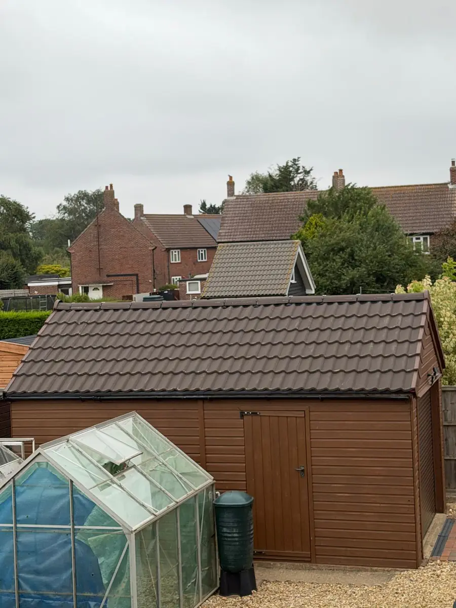 Garage roof in Redland 49 tile and a torch-on felt summer house roof