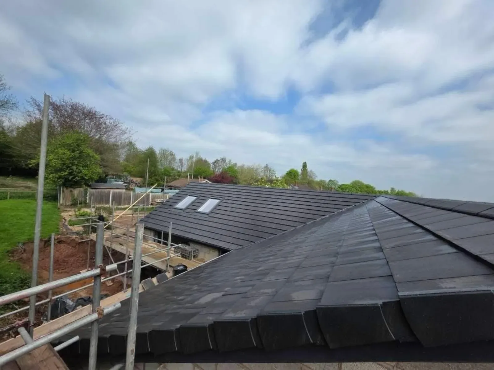 A new build roofed in dark concrete tile, with rooflights, image 6