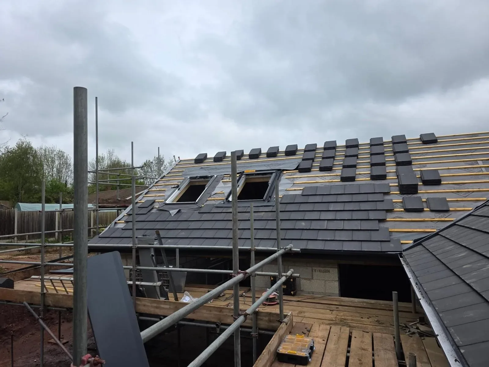 A new build roofed in dark concrete tile, with rooflights, image 13