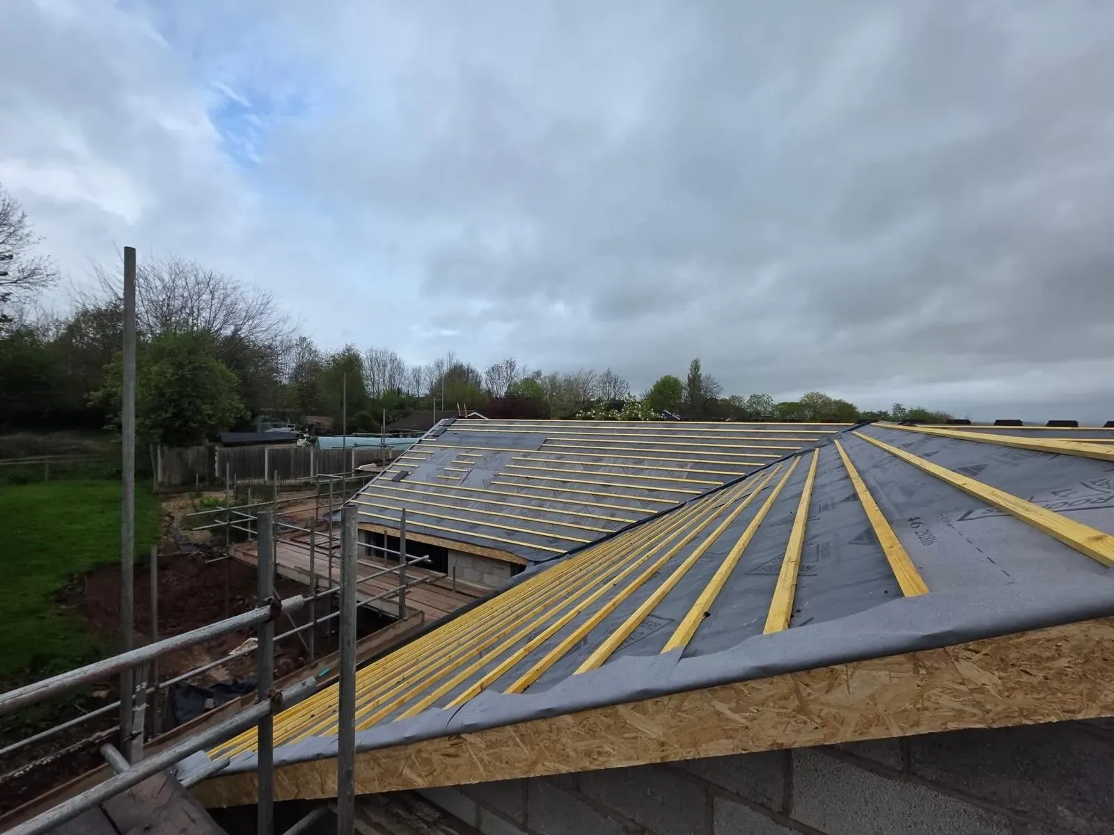 A new build roofed in dark concrete tile, with rooflights, image 16